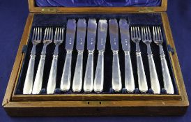 A cased set of eleven pairs of silver threaded Old English pattern fish eaters, Harman & Co, London,