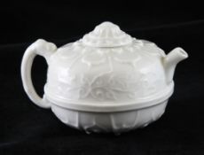 A Chinese blanc de chine compressed globular wine pot, the top moulded as a chrysanthemum, with