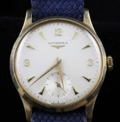 A gentleman`s 9ct gold Longines manual wind wrist watch, with baton and Arabic numerals and