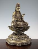 A Chinese giltwood seated figure of Guanyin, with separate aureole and double lotus stand, 23.25in.