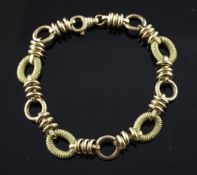 An 18ct gold wire work oval link bracelet, 18 grams, 7.25in.