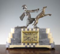 A French Art Deco grey marble and onyx mantel clock, the stepped case mounted with a female figure