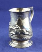 A George II silver baluster mug with later embossed horse racing scene and French inscription,