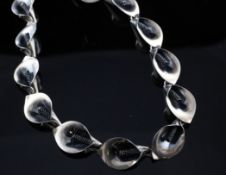 A stylish 1960`s Danish sterling silver necklace, by Niels Erik From, with thirteen petal style