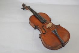 A French Stradiverias copy violin, with paper label to interior with one piece back, together with