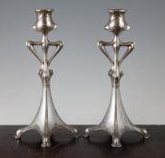 A pair of Art Nouveau silvered pewter candlesticks, marked to the base DBE, for Dupper & Bernhold