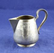 A late 19th/early 20th century Russian 84 zolotnik silver sparrow beak cream jug, with engraved