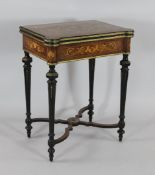 A Louis XVI style marquetry inlaid and kingwood card table, with folding top, on fluted legs and X