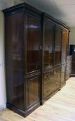 A large Edwardian mahogany wardrobe, with central doors revealing sliding trays over two short and