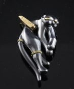 A Cartier 18ct gold and blackened silver panther pendant, stamped "Cartier, 750" with French gold