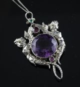 A 20th century French? silver, amethyst and gem set pendant, the central stone flanked by winged