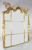 A 19th century Continental carved giltwood mirror, with musical trophy, acanthus scroll and ribbon