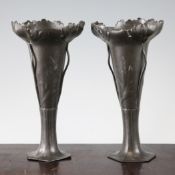 A pair of Orivit Art Nouveau pewter vases, with sinuous decoration and flower leaf motifs, with