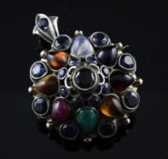 A late 19th/early 20th century Indian? gold, silver and multi gem pendant brooch, of domed form, set