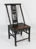 A late 19th / early 20th century carved Chinese rosewood side chair, the frame decorated with bamboo
