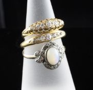 Two early 20th century 18ct gold and seven stone diamond dress rings and a 9ct gold and white opal