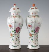 A pair of Chinese famille rose lobed baluster vases, Qianlong period, each painted with floral