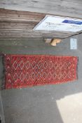 A Turkish kelim with polychrome field of geometric diamond motifs and zigzag border, 13ft 2in by