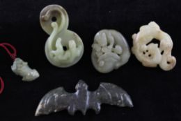 A group of five Chinese jades and a serpentine carving, comprising a celadon and brown jade