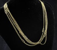 An 18ct gold curb link guard chain, with intermittent elongated oval links, 60in, 26.9 grams.