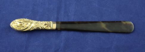 A late Victorian repousse 9ct gold handled tortoiseshell paper knife, decorated with scrolls, L.