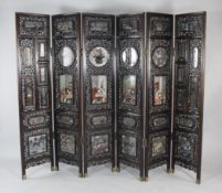 A fine Chinese rosewood and reverse painted six fold screen, late 19th century, the rectangular,