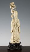 A large Chinese ivory figure of Shou Lao, early 20th century, standing holding a peach in his left