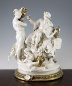 A large Italian gilt decorated white porcelain group, depicting Bacchus, two female attendants and