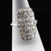 A 1920`s platinum and diamond cluster dress ring, of shaped rectangular form, set with twenty