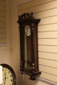 A walnut and ebony Vienna wall clock with architectural case and enamelled dial, 3ft.