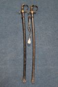 A WWII Nazi officer`s sword and scabbard, the blade marked for PS Solingen, together with another