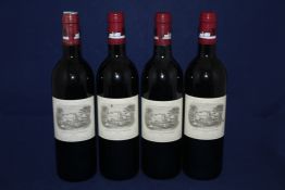 Four bottles of Chateau Lafite 1995, Premier Cru Classe, Pauillac; all high fills, two with small