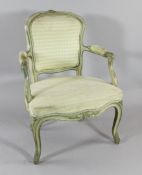 A French cream and green painted fauteuil, with yellow chequer upholstery