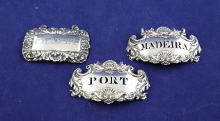A pair of George IV silver wine labels, Madeira & Port, of cartouche form, with shell scroll