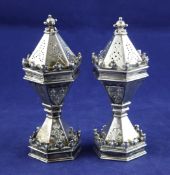 An ornate pair of late Victorian silver Diamond Jubilee commemorative pepperettes, by R & S