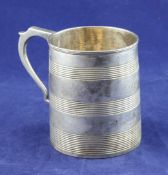 A George III silver christening mug, of restrained tapering form, with reeded bands and engraved