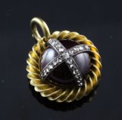 A Victorian gold, diamond and cabochon garnet set mourning pendant locket, of spherical form, with
