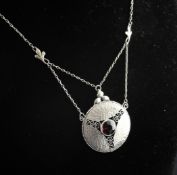 An Edwardian Arts & Crafts 935 standard silver and garnet set pendant necklace by Murrle Bennett &