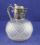 A Victorian silver plate mounted claret jug, of globular form, with engraved foliate scroll