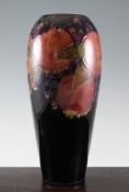 A Moorcroft `Pomegranate` tall ovoid vase, c.1916, on cobalt blue ground, inscribed `W Moorcroft`