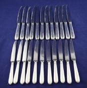 A set of twelve 1960`s silver handled table knives and eleven dessert knives, William Comyns &