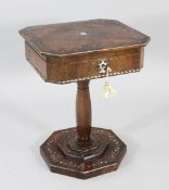 A Continental rosewood and mother of pearl inlaid work table, the hinged top revealing fitted
