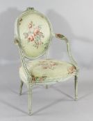 A Louis XVI design painted fauteuil, with oval padded floral upholstered back and seat
