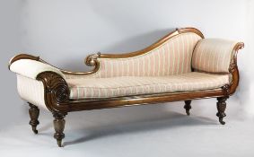 A William IV rosewood chaise longue, with scrolling back and pink stripe fabric, on turned tapered