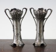 A small pair of WMF two handled vases, with stylised floral decoration, no liners, 6in.