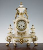 A late 19th century French ormolu mounted alabaster mantel clock, of architectural form with dial