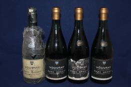 Four bottles of Vouvray, Marc Bredif, three from 1947 and one from 1937. Levels 3.5-4.5 cm below