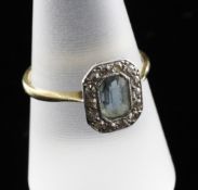 An 18ct gold, aquamarine and diamond cluster ring, of octagonal form, size R.