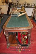 A large 19th century mahogany library table, with green cloth inset top and fluted and turned