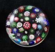 A Clichy spaced millefiori paperweight, 19th century, decorated with complex floral canes, 3in.
